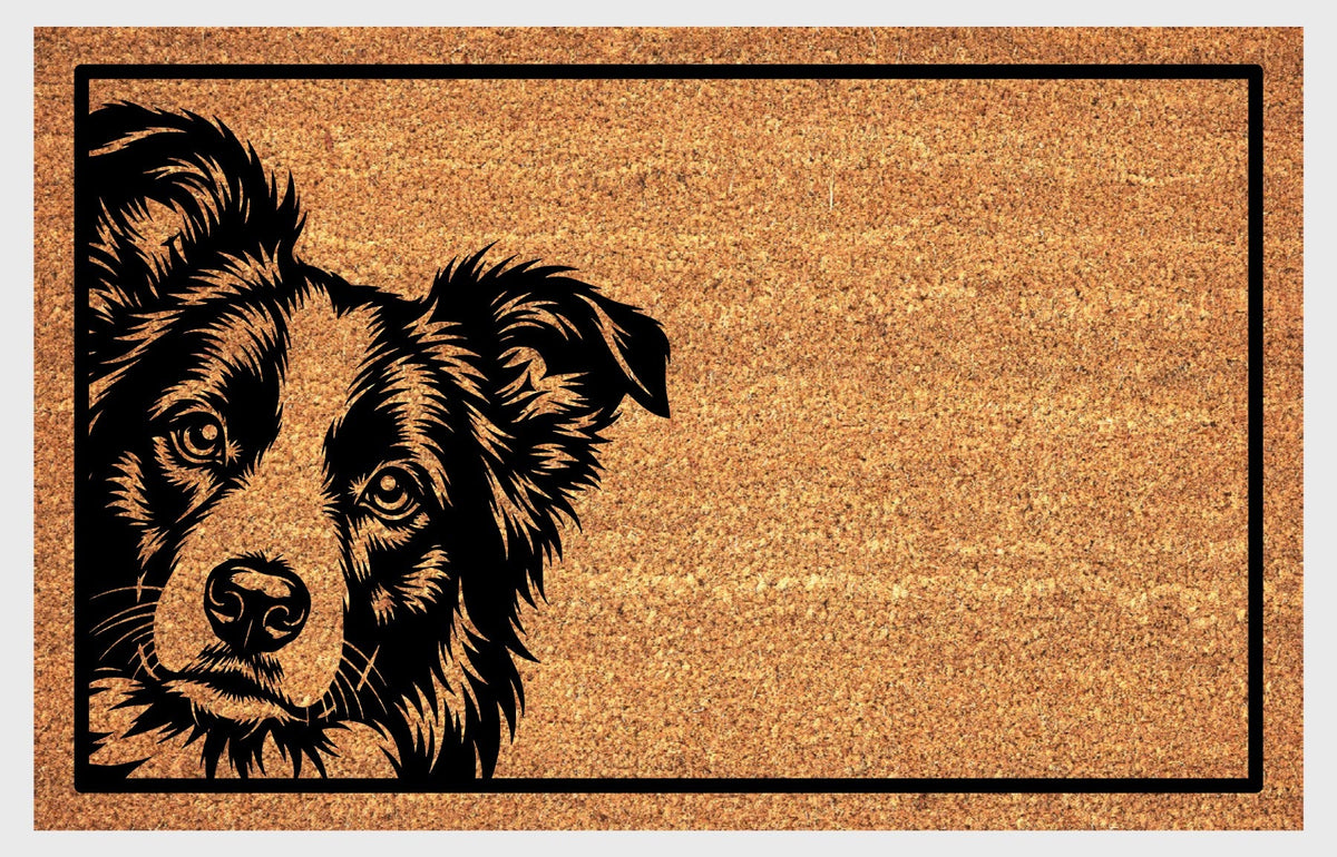 Border Collie Peeking Doormat #1, detailed Collie face peeking from the left edge of a natural coir mat with a black rectangular border, flat lay on a white background.