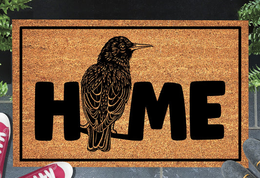Starling bird doormat #1 with home text placed at front door entryway