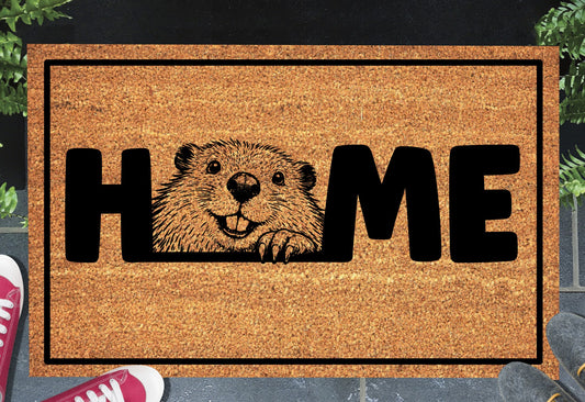 Beaver doormat with 'HOME' text, placed outdoors.