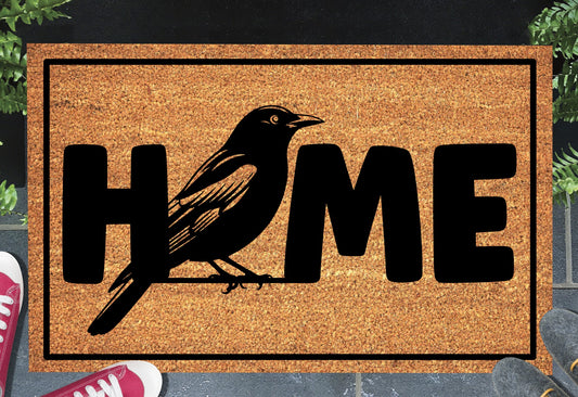 Blackbird doormat #1 with home text placed at front door entryway