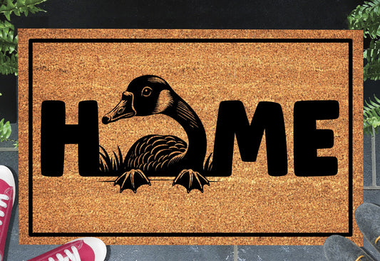 Goose doormat #1 with home text placed at front door entryway