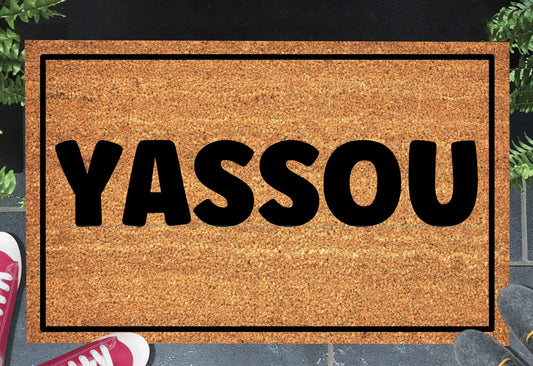 Yassou Greek welcome doormat placed at front door entrance