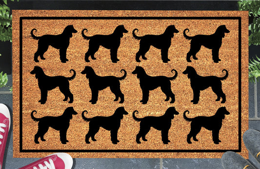 Afghan Hound Parade coir doormat in a doorway setting — rows of Affie silhouettes in a repeating pattern on a natural coir mat with black border.
