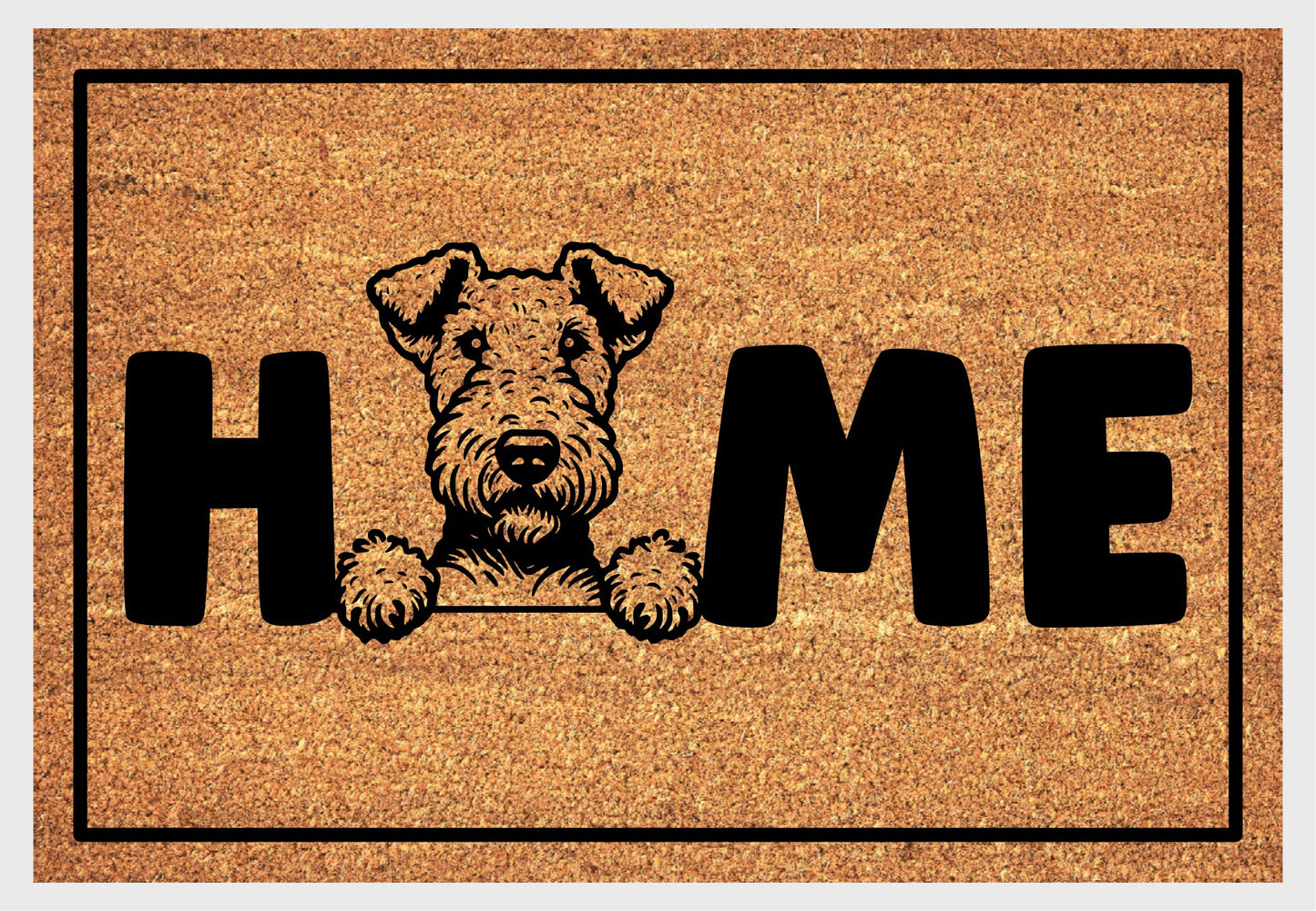 Airedale Terrier coir doormat with portrait illustration of an Airedale Terrier replacing the letter O in bold black HOME lettering, on a natural golden coir surface with black border, plain white background