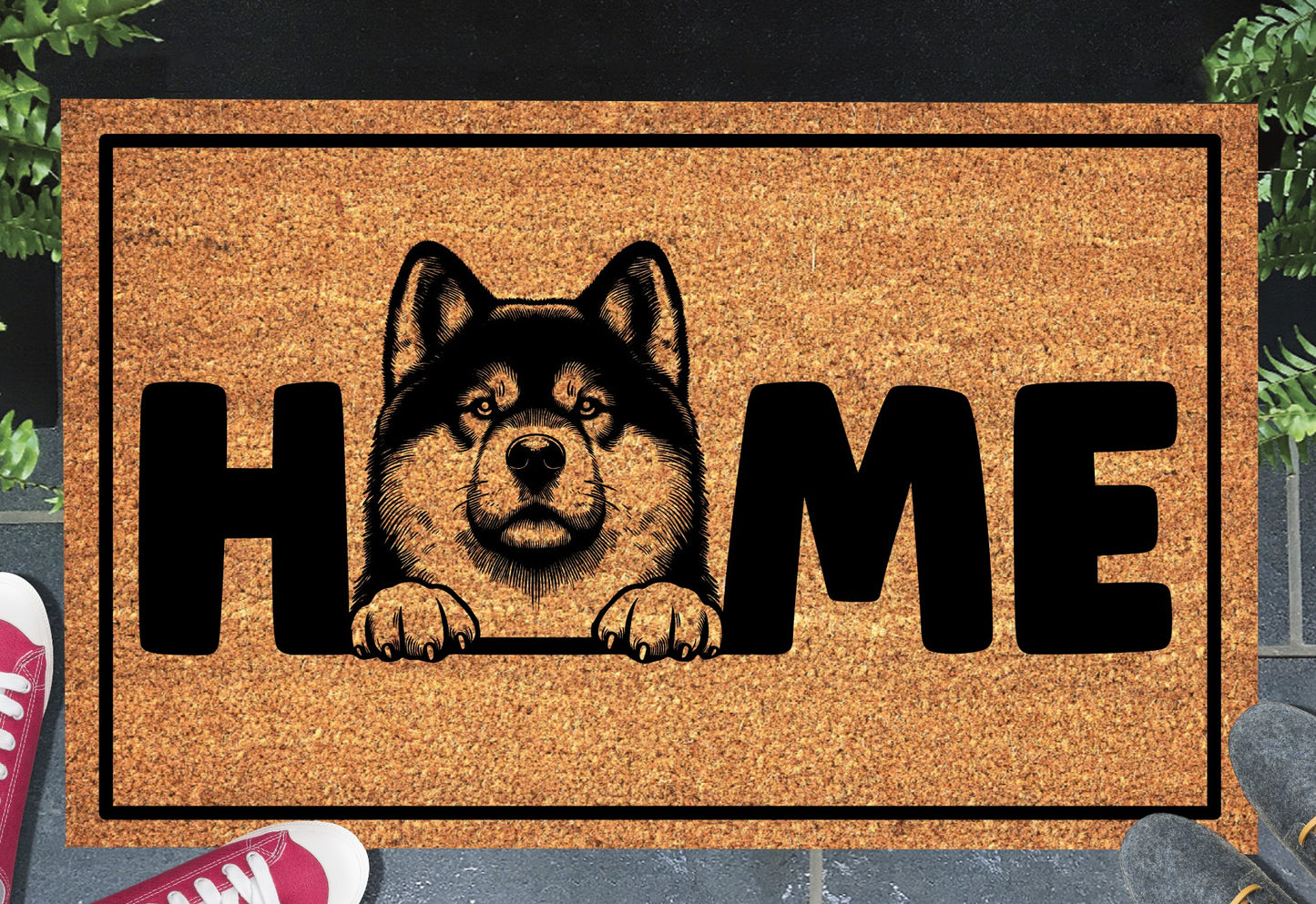 Akita coir doormat with portrait illustration of an Akita replacing the letter O in bold black HOME lettering, on a natural golden coir surface with black border, styled on a slate doorstep.