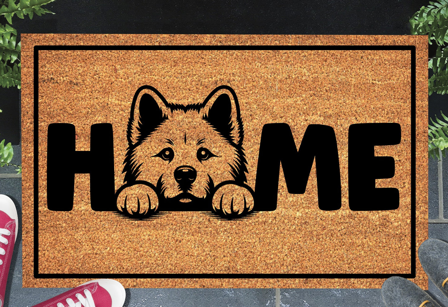 Akita coir doormat with portrait illustration of an Akita replacing the letter O in bold black HOME lettering, on a natural golden coir surface with black border, styled on a slate doorstep. 