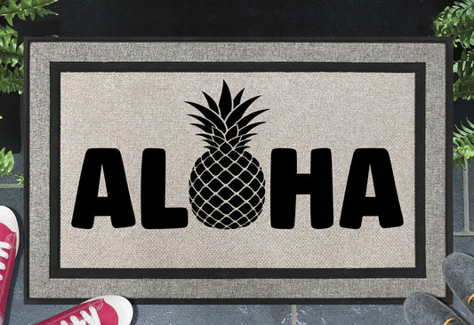 Aloha Doormat #1 all weather mat with Hawaiian welcome text placed at front door entryway