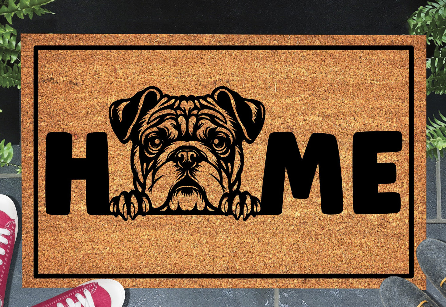 American Bulldog HOME doormat in doorway lifestyle shot — natural tan coir mat, wrinkle-faced American Bulldog head and paws illustration replaces the letter O in HOME