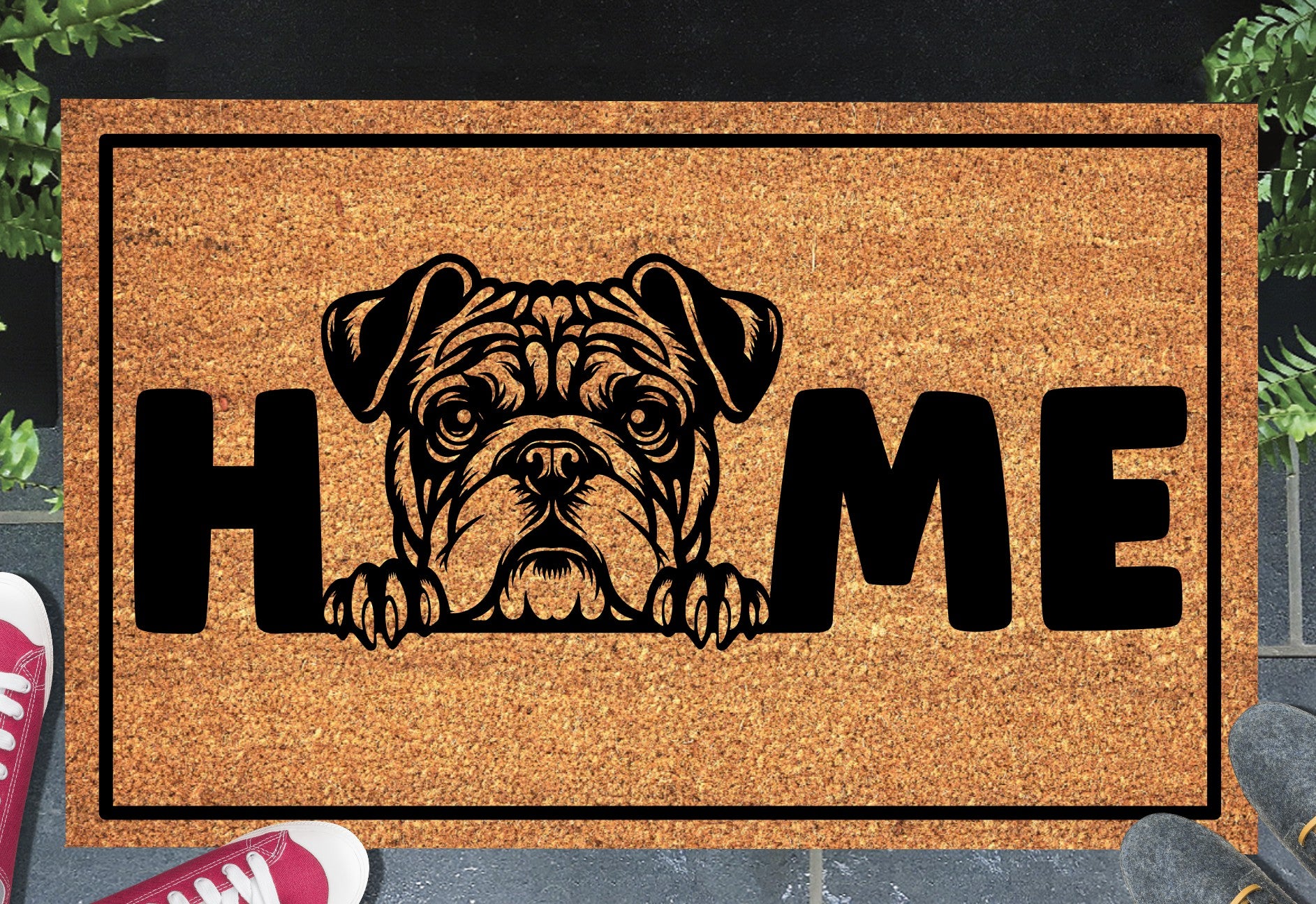 American Bulldog HOME doormat in doorway lifestyle shot — natural tan coir mat, wrinkle-faced American Bulldog head and paws illustration replaces the letter O in HOME