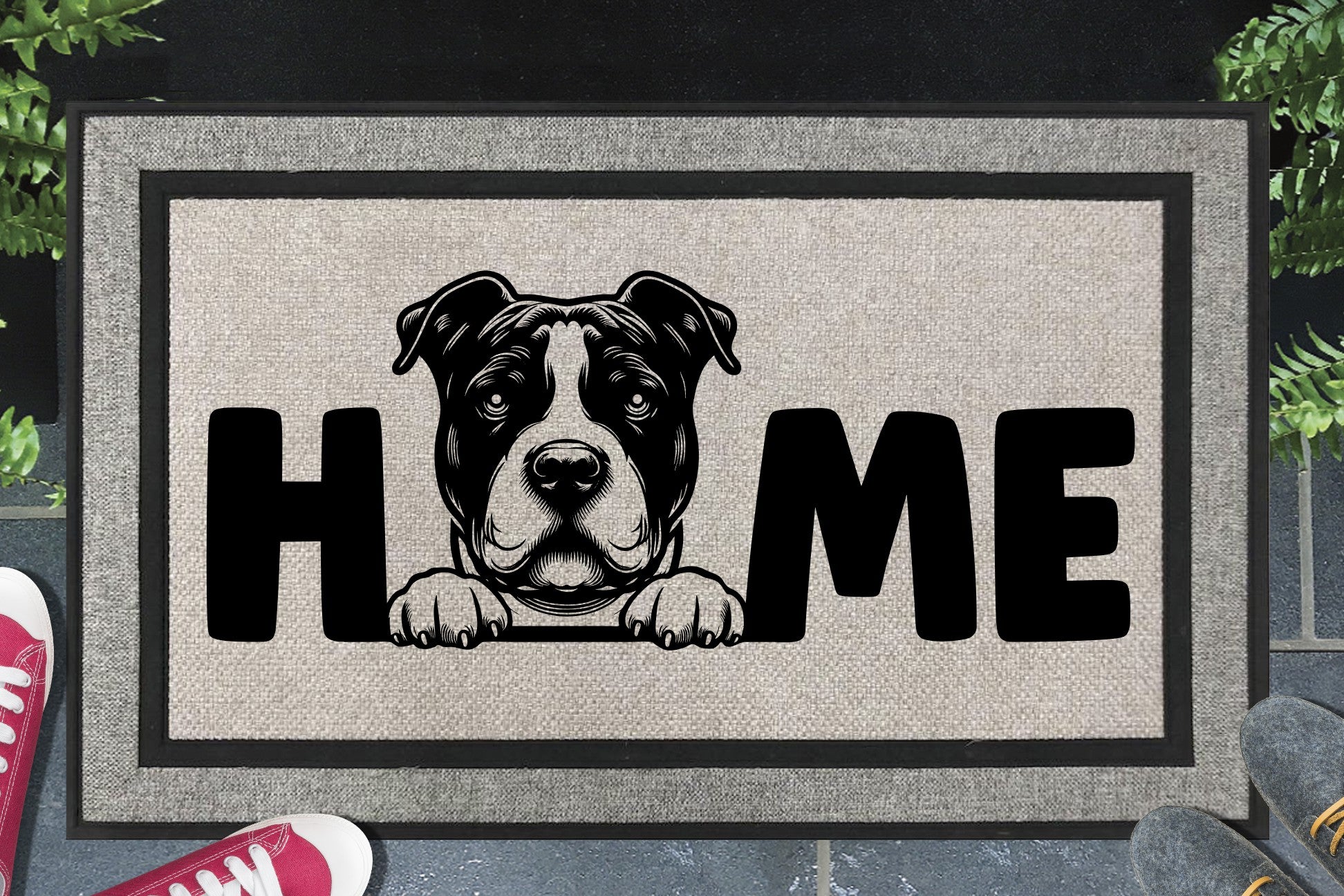 American Bully all-weather doormat in a doorway — Bully illustration replacing the letter O in "HOME", UV-cured inks on woven polyester, front door entryway