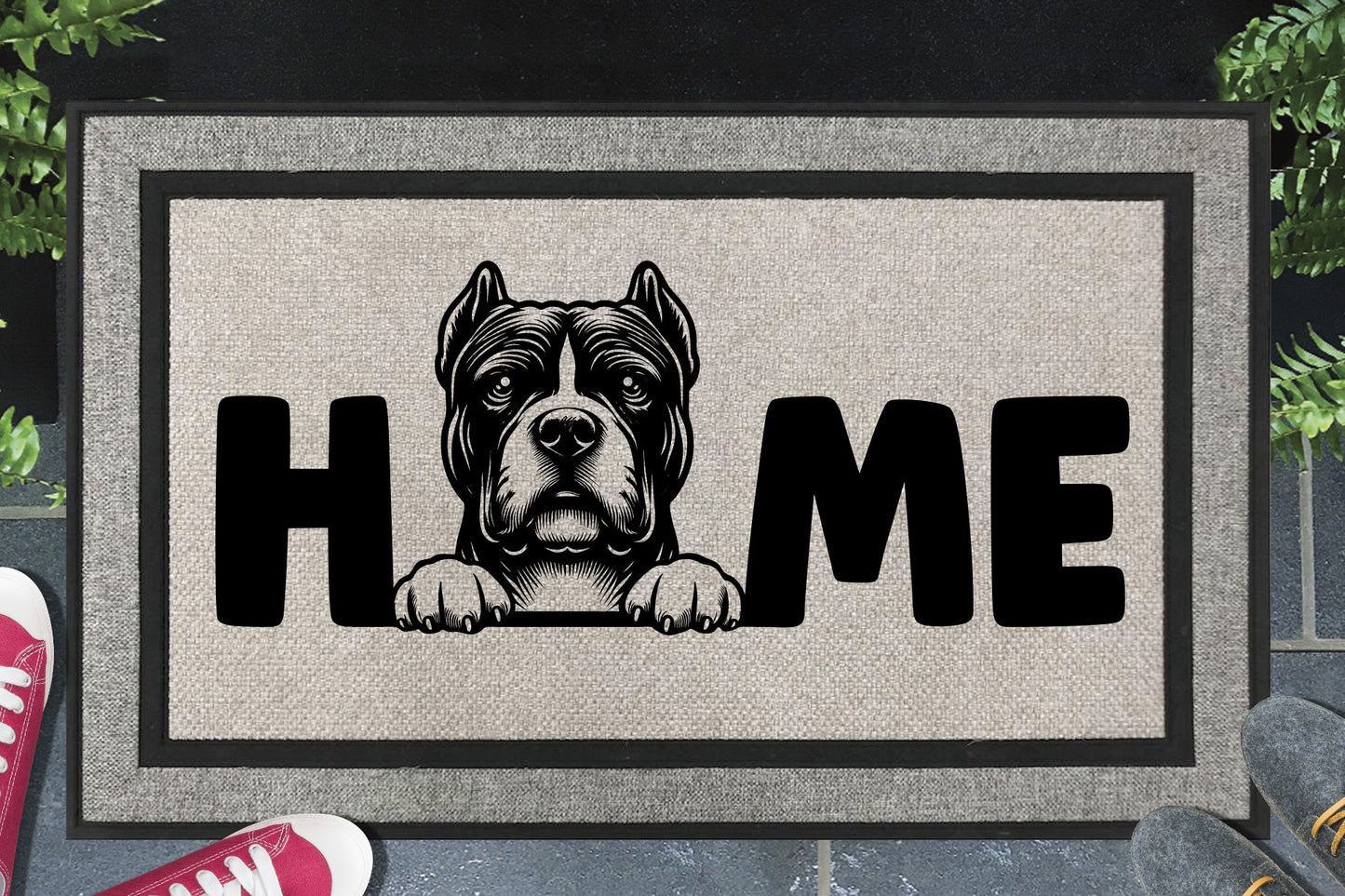 Pocket Bully all-weather doormat in a doorway — Bully illustration replacing the letter O in "HOME", UV-cured inks on woven polyester, front door entryway