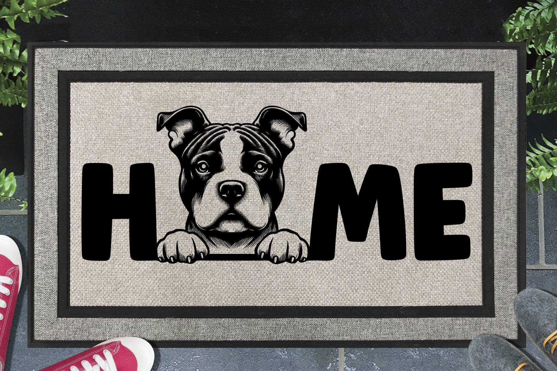 Classic American Bully all-weather doormat in a doorway — Bully illustration replacing the letter O in "HOME", UV-cured inks on woven polyester, front door entryway
