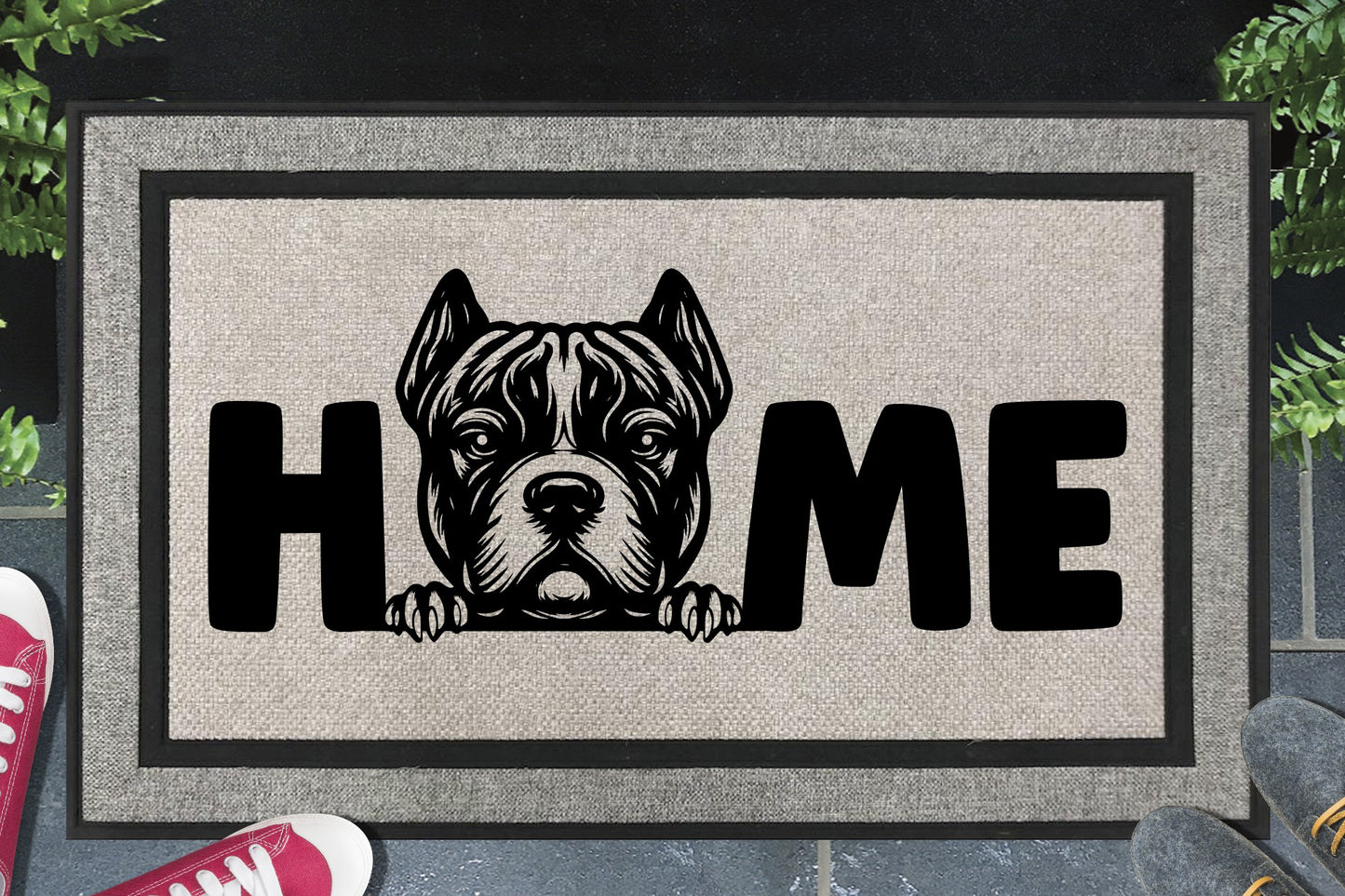 XL American Bully all-weather doormat in a doorway — Bully XL illustration replacing the letter O in "HOME", UV-cured inks on woven polyester, front door entryway