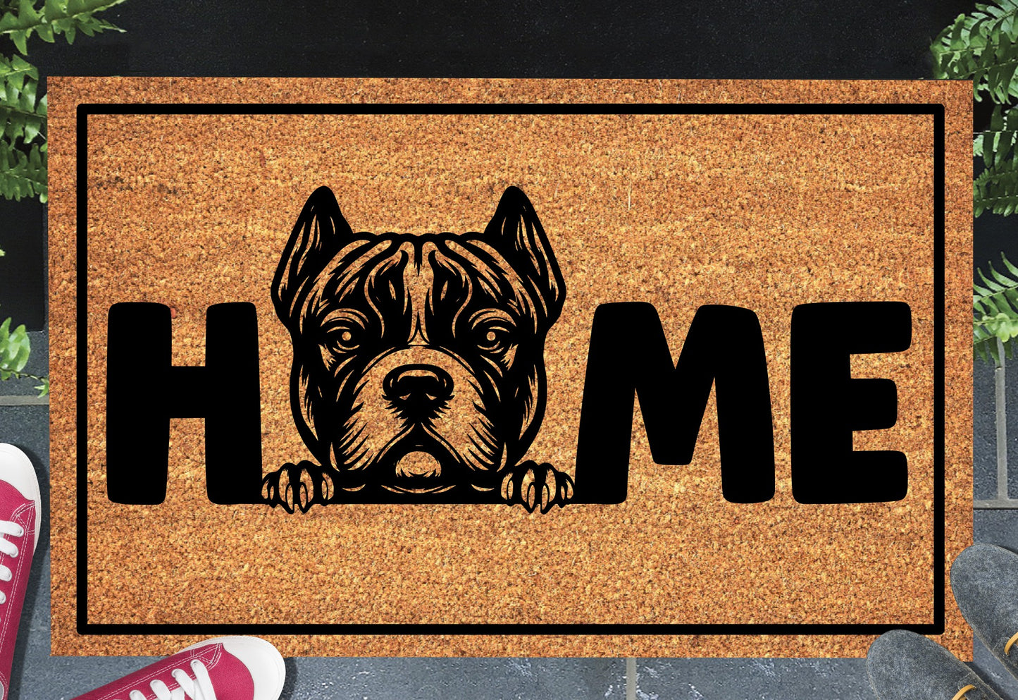 American Bully XL coir doormat in a doorway — XL Bully illustration replacing the letter O in "HOME" on natural coir, front door entryway