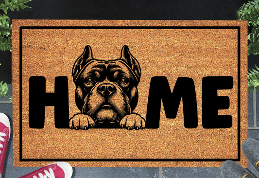 American Bully coir doormat in a doorway — Bully illustration replacing the letter O in "HOME" on natural coir, front door entryway