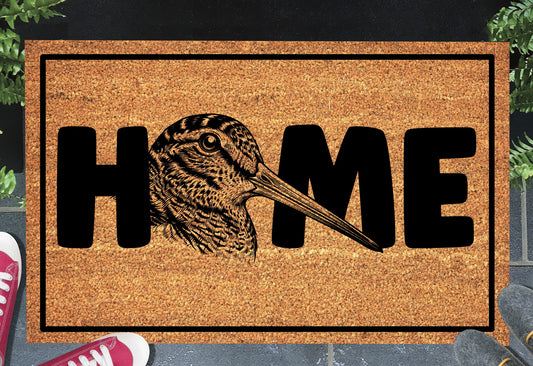 American Woodcock doormat #2 shown at front door entryway — natural coir with non-slip backing
