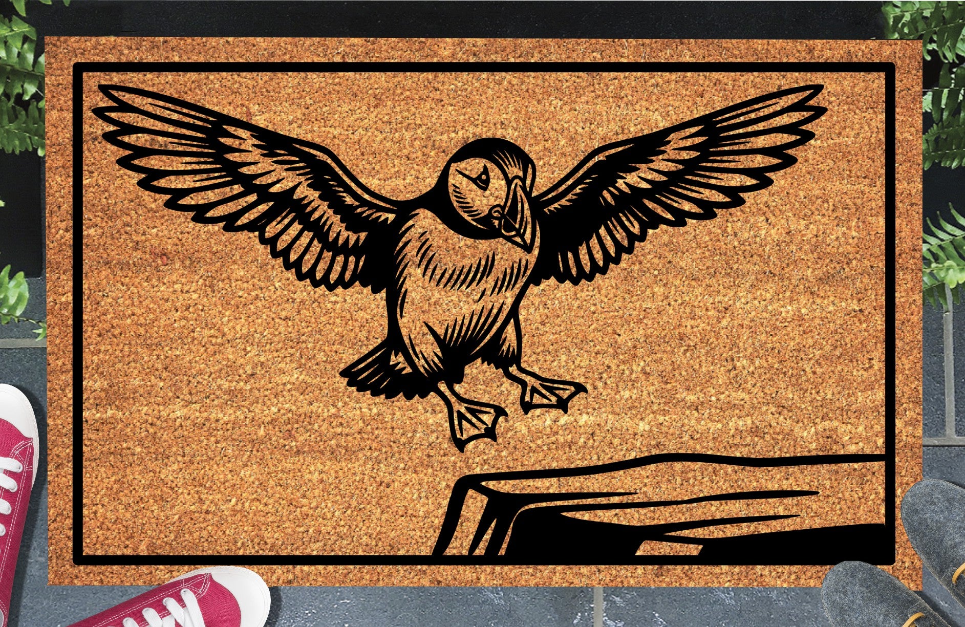 Atlantic Puffin coir doormat in a doorway — scenic illustration of Puffin coming in to land, wings raised, on a clifftop ledge, on natural coir
