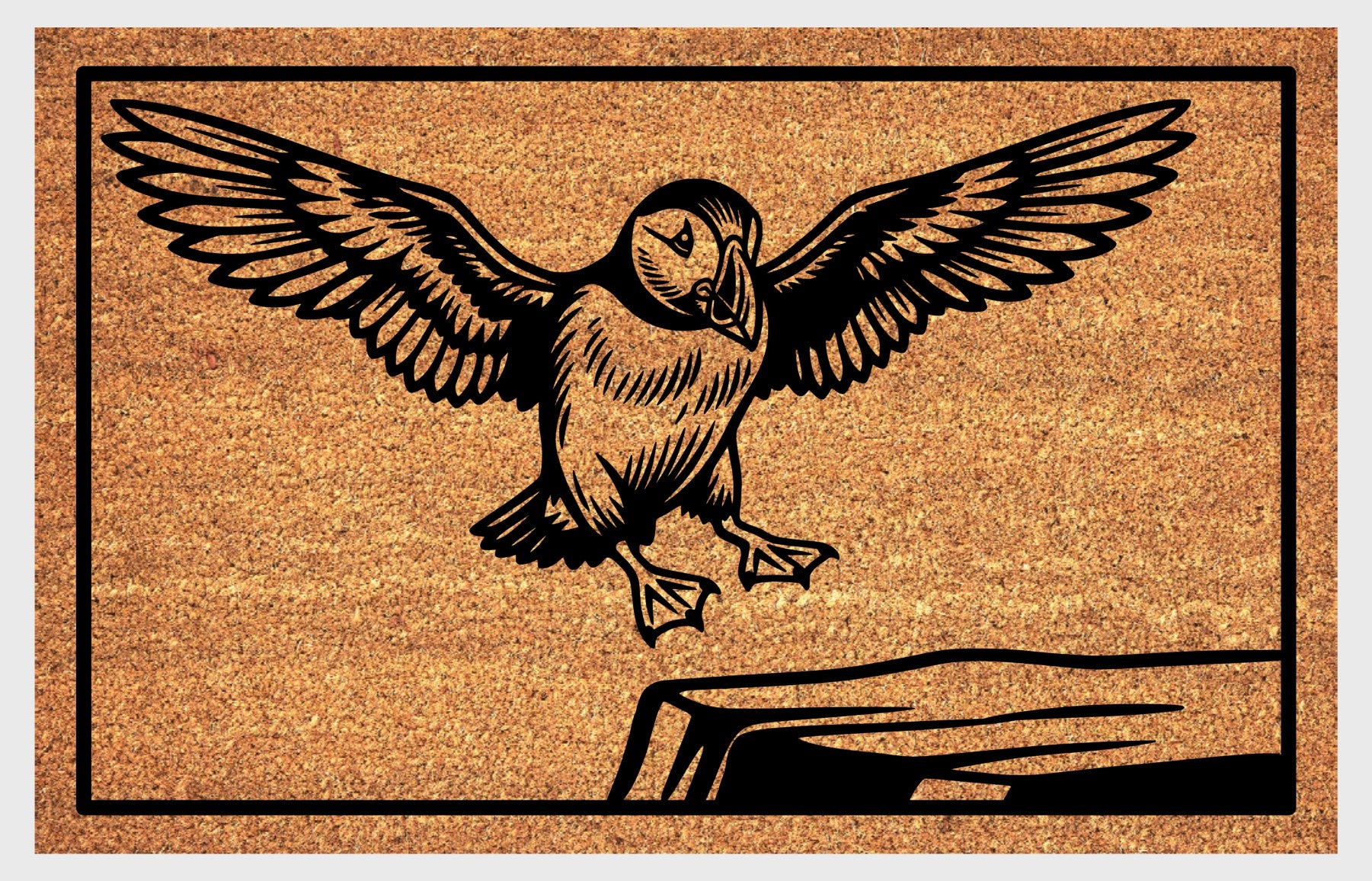 Atlantic Puffin coir doormat flat lay — scenic illustration of Puffin coming in to land, wings raised, on a clifftop ledge, on natural coir