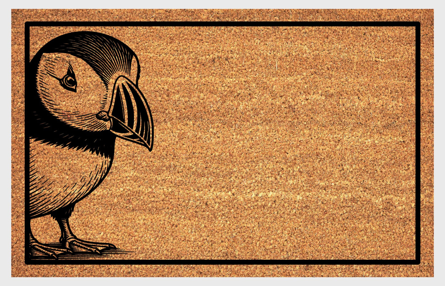 Atlantic Puffin welcome mat at front door — Tammie Norie landing design on natural coir