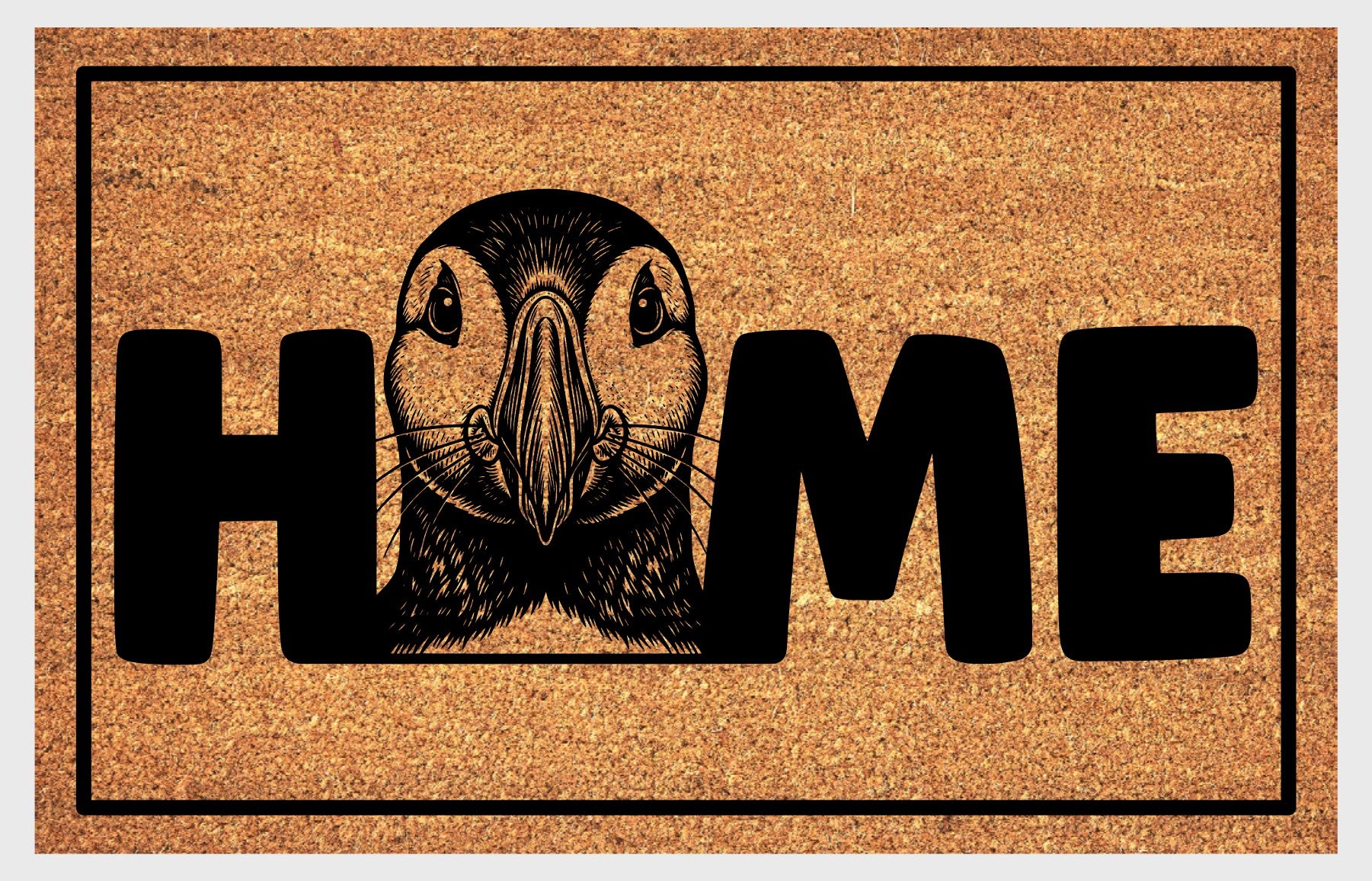 Atlantic Puffin coir doormat flat lay — Puffin illustration replacing the letter O in "HOME" on natural coir