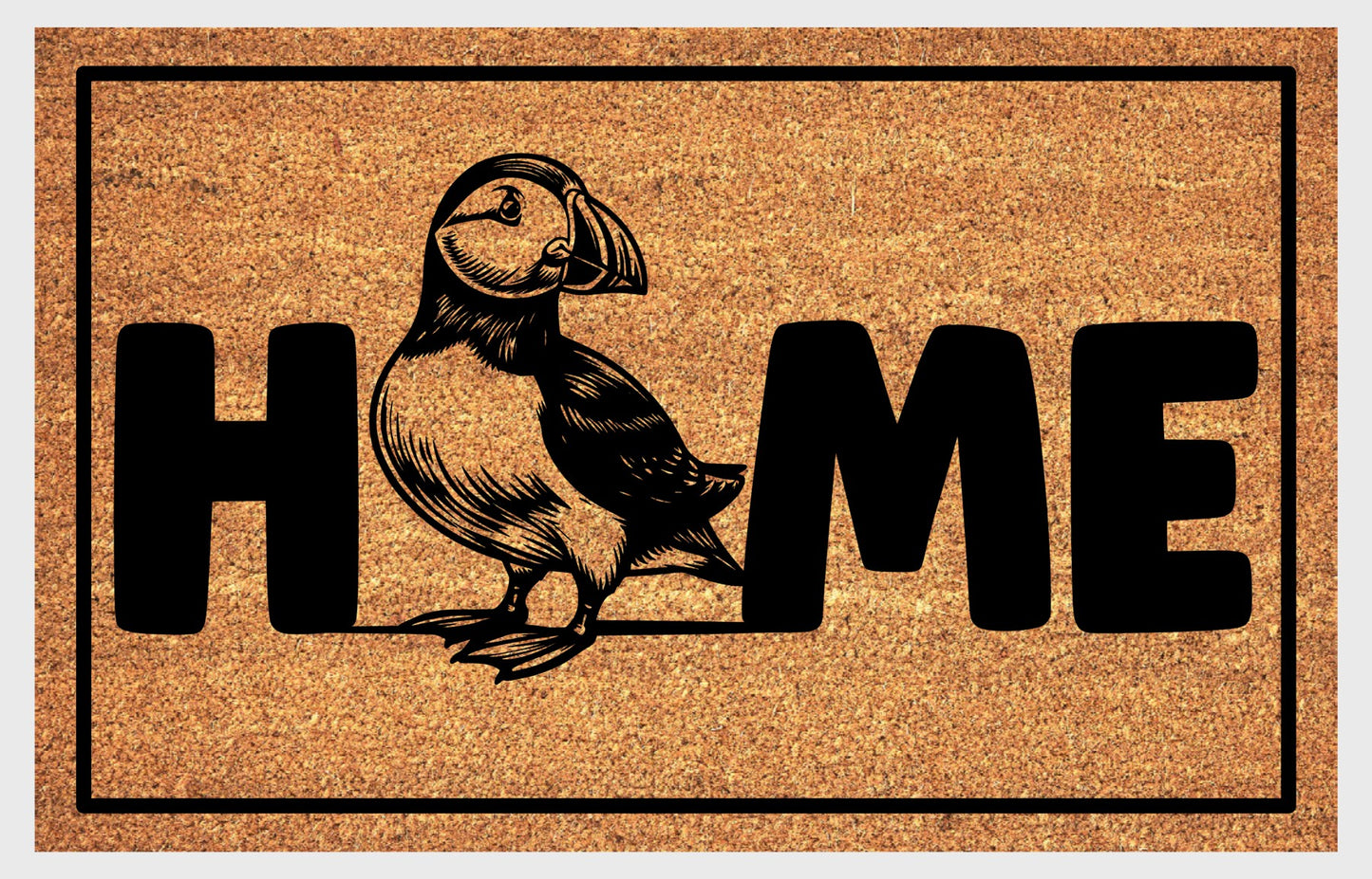 Atlantic Puffin coir doormat flat lay — full-body Puffin illustration replacing the letter O in "HOME", natural coir home décor mat