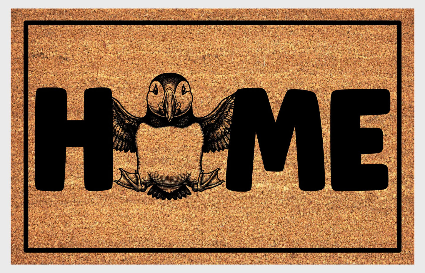 Atlantic Puffin Sea Parrot coir doormat flat lay — full-body Atlantic Puffin with wings spread replaces the letter O in HOME on a natural coir welcome mat with non-slip backing