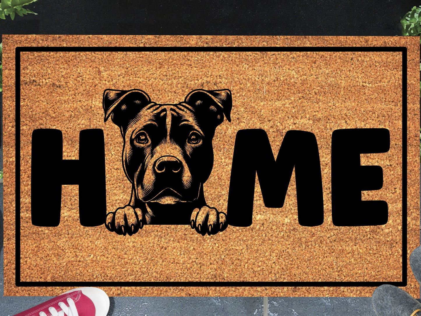 American Pit Bull Terrier coir doormat in a doorway — Pittie illustration replacing the letter O in "HOME" on natural coir, front door entryway