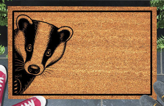 Badger peeking coir doormat displayed on front porch entryway — natural coir mat with badger peeping from the edge