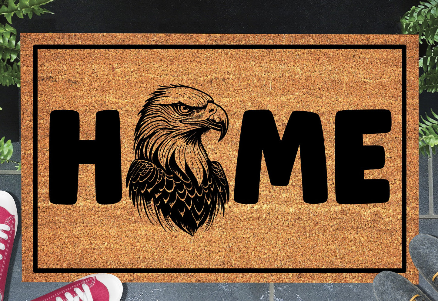 American Bald Eagle HOME doormat in doorway lifestyle shot — natural tan coir mat, Bald Eagle head portrait illustration replaces the letter O in HOME