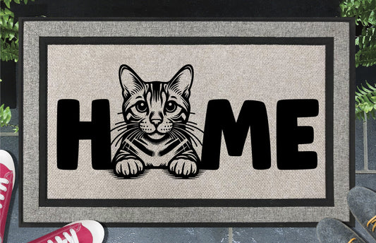 Bengal Cat all-weather doormat #3 featuring a Benny illustration replacing the letter O in HOME, woven polyester, 18x30