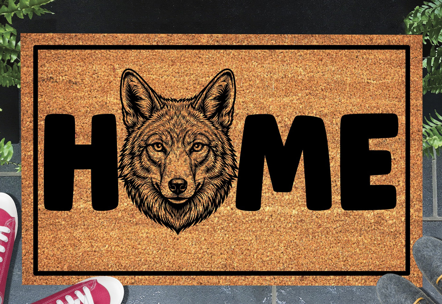 Coyote Doormat #5 shown on a front doorstep — fifth alternate portrait-style coyote illustration with HOME lettering on a natural coir mat with black border
