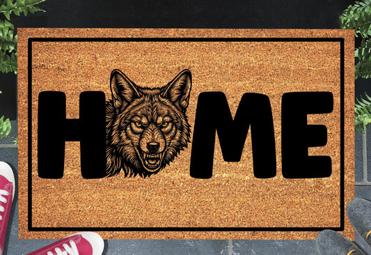 Coyote Doormat #6 shown on a front doorstep — sixth alternate portrait-style snarling coyote illustration with HOME lettering on a natural coir mat with black border