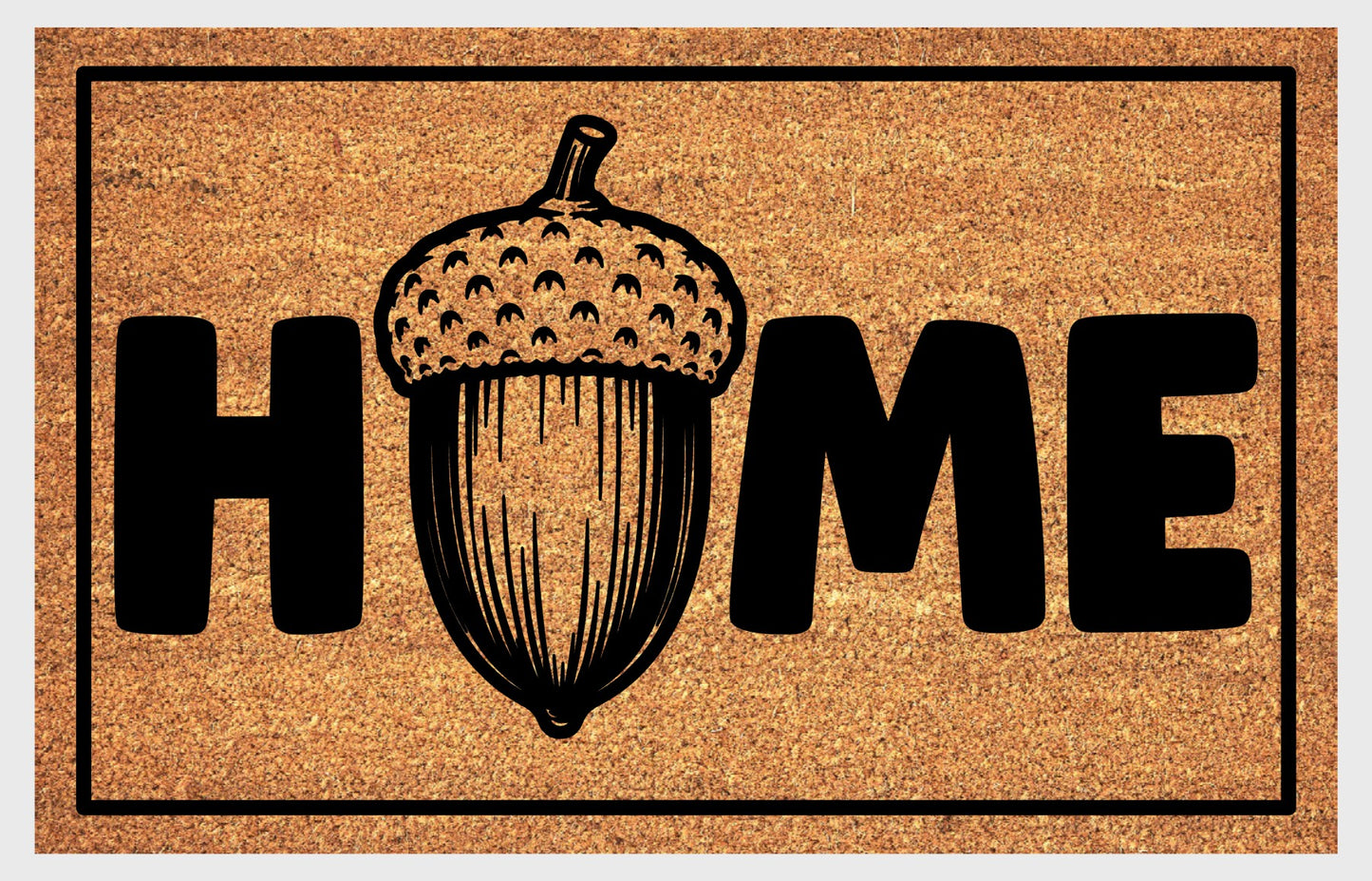 English Oak Pedunculate Oak acorn coir doormat with bold black HOME lettering and detailed acorn illustration replacing the letter O, on a natural golden coir surface with black border, plain background