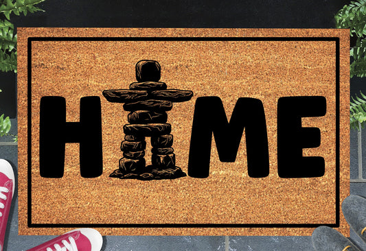 Inukshuk Doormat #1 on a front doorway — natural coir Canada welcome mat