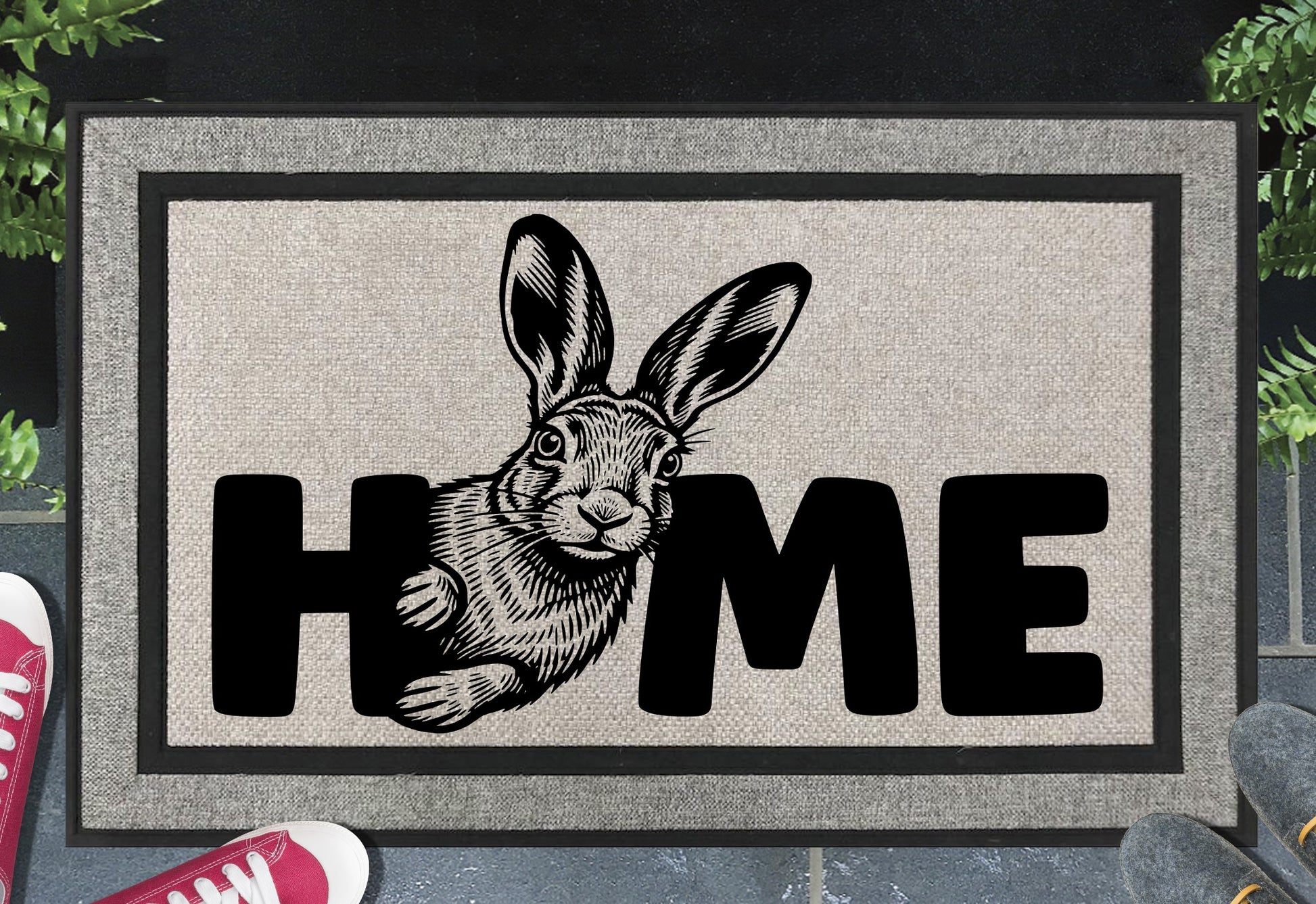 Irish Hare doormat styled at a front doorway — grey woven polyester with rubber border and HOME text