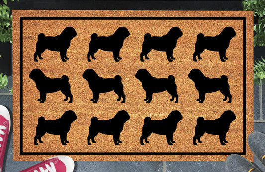 Pug Parade coir doormat in a doorway setting — rows of Pug silhouettes with curled tail and stocky frame in a repeating pattern on a natural coir mat with black border
