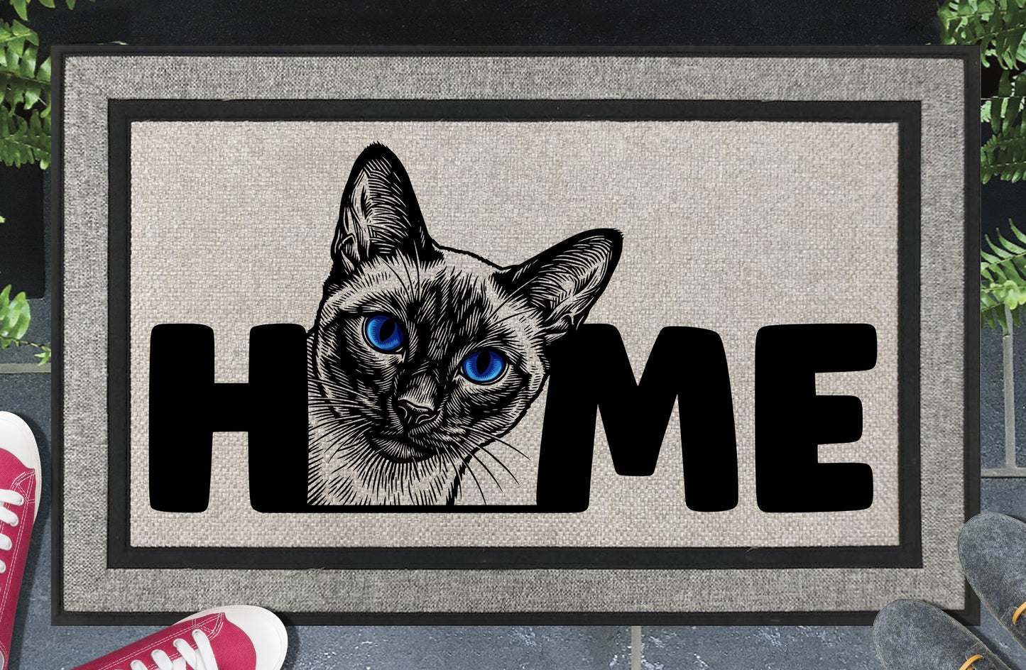 Siamese Cat all-weather doormat in a doorway setting — Meezer portrait illustration with piercing blue eyes replacing the letter O in HOME on a woven polyester mat with grey linen look finish and black border