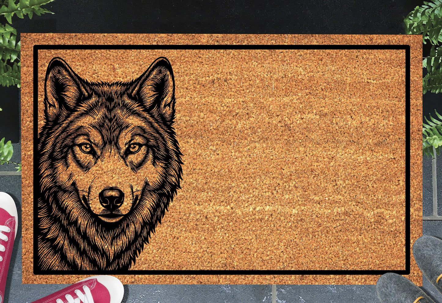 Wolf Doormat #1 shown on a front doorstep — portrait-style etched wolf face peering from the left side on a natural coir mat with black border