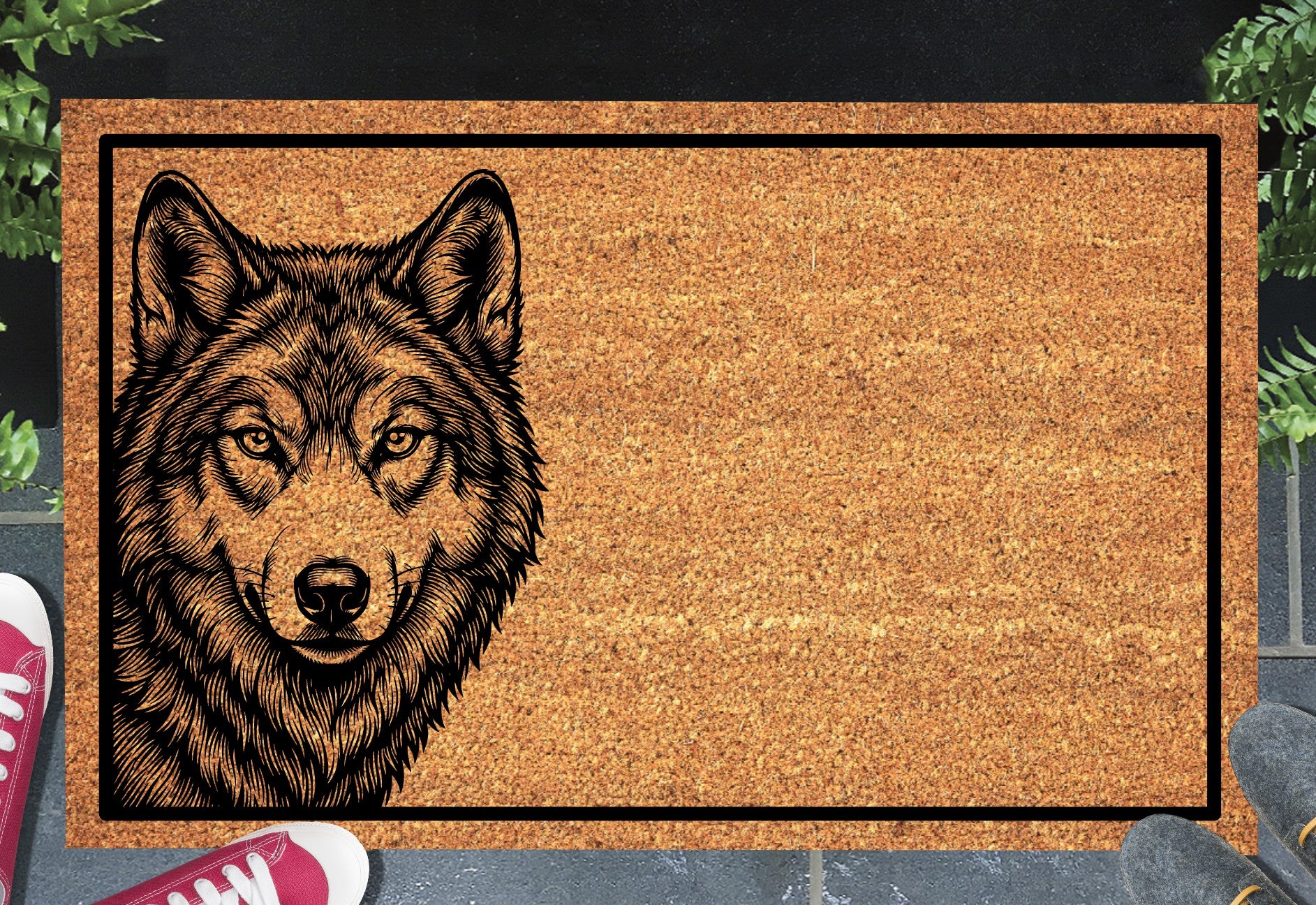 Wolf Doormat #1 shown on a front doorstep — portrait-style etched wolf face peering from the left side on a natural coir mat with black border