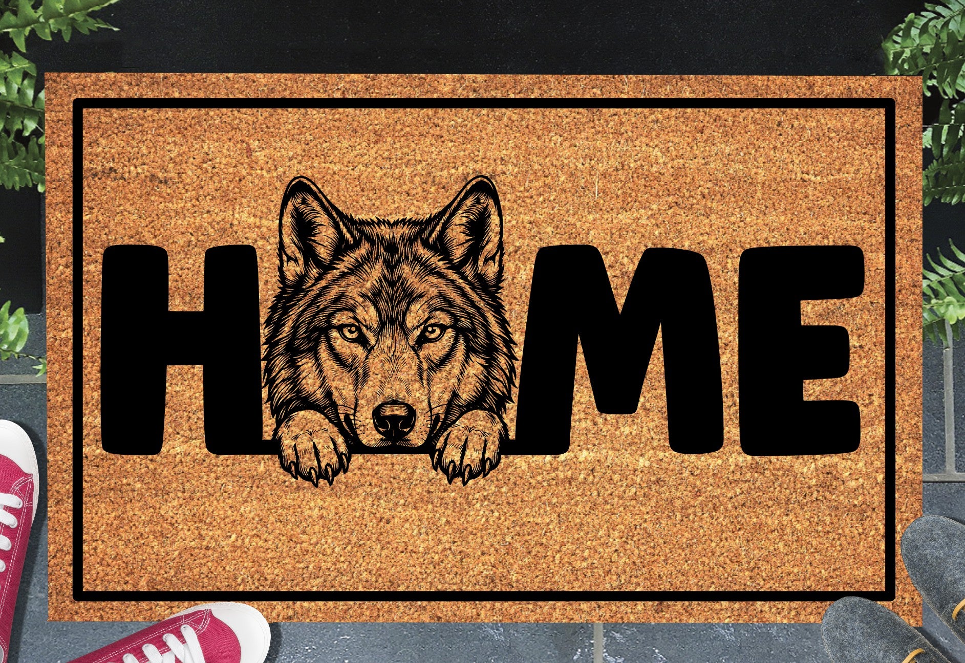 Wolf Doormat #1 shown on a front doorstep — portrait-style wolf illustration with HOME lettering on a natural coir mat with black border