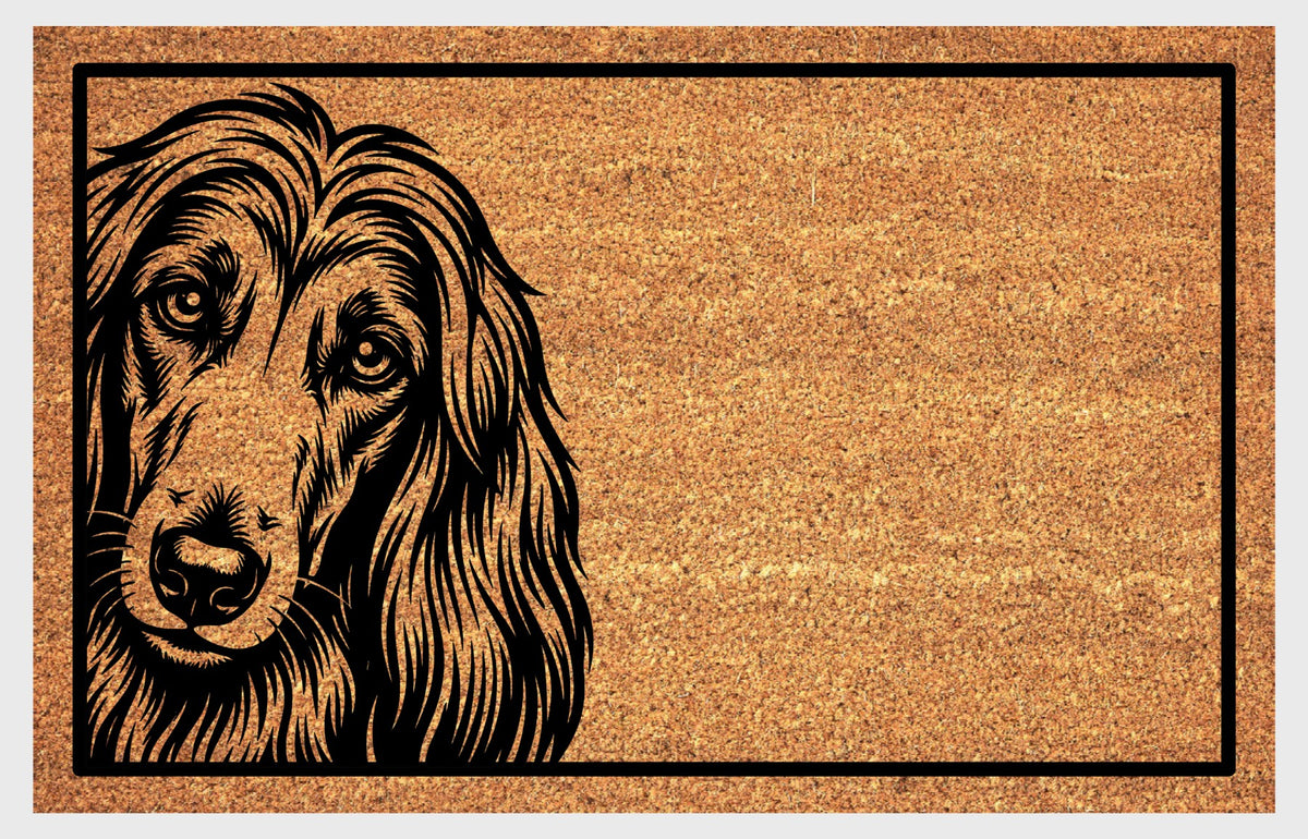 Afghan Hound Peeking coir doormat with a long-haired Afghan Hound illustration peeking from the left edge and a black rectangular border, flat view