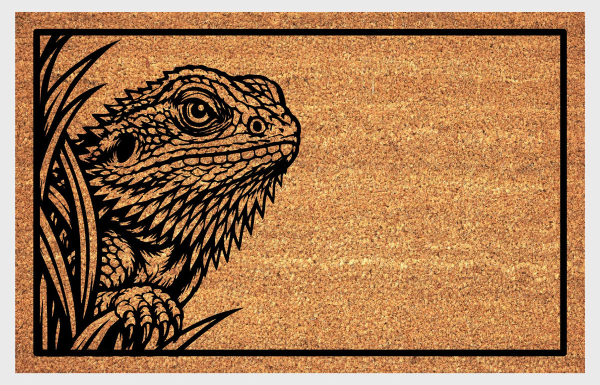 Bearded Dragon Peeking coir doormat with detailed Beardie artwork, foliage and a black rectangular border, flat front view