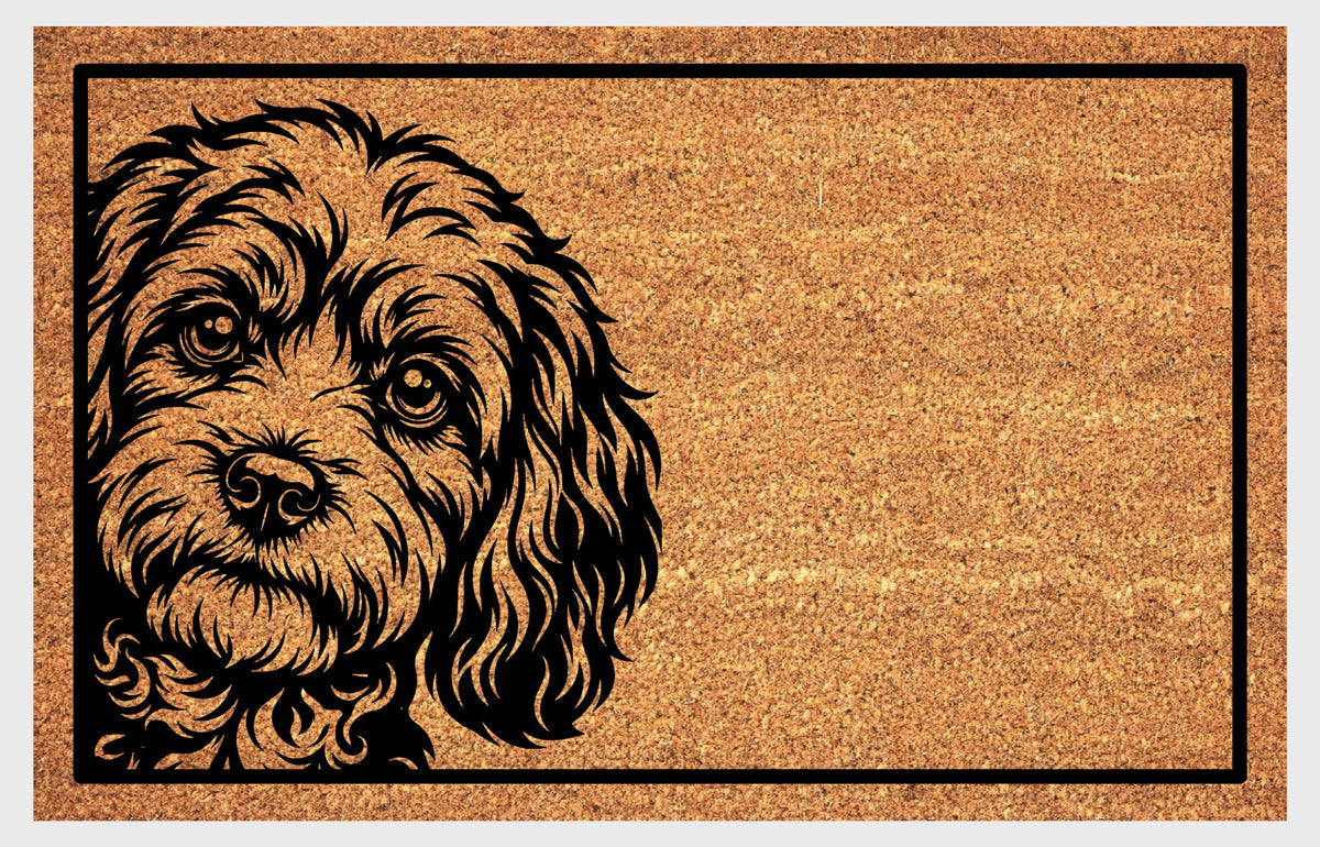 Cavapoo Peeking coir doormat #1, front view of the Cavoodle portrait with floppy ears and expressive eyes on natural coir