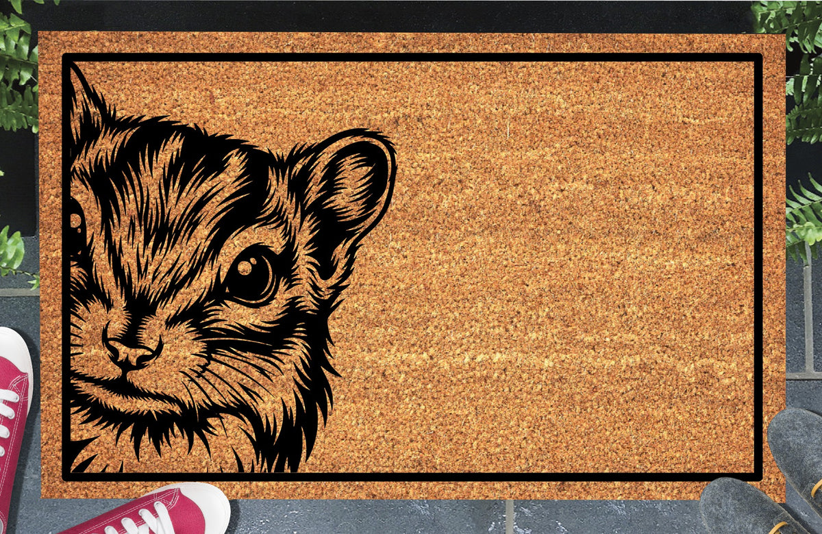 Chipmunk Peeking coir doormat #2 with a detailed Chippy portrait at the left edge and black rectangular border, shown on a doorstep