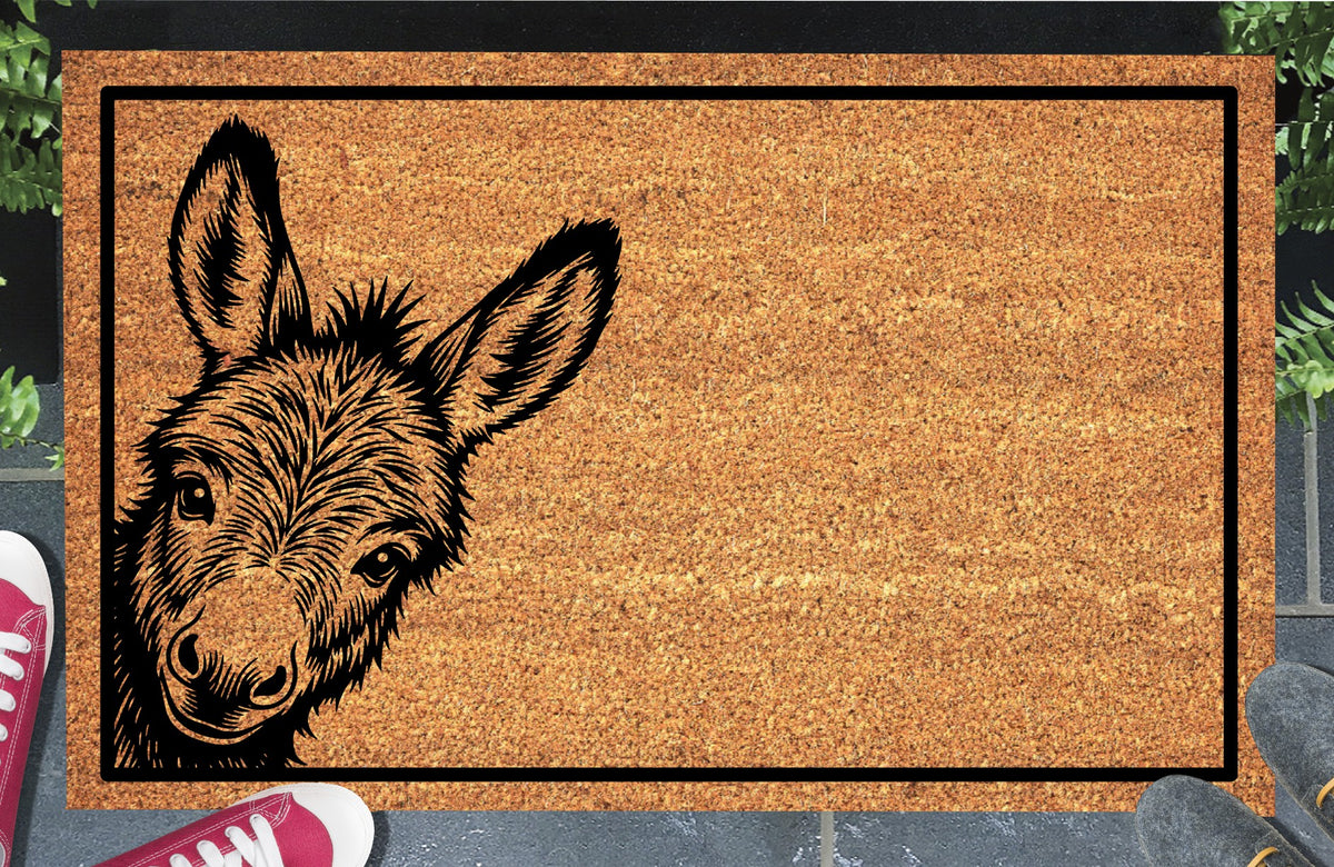 Donkey Peeking Doormat #1 coir doormat — Donkey peeking in from the side edge, natural coir fiber, non-slip rubber backing, flat lay on white background