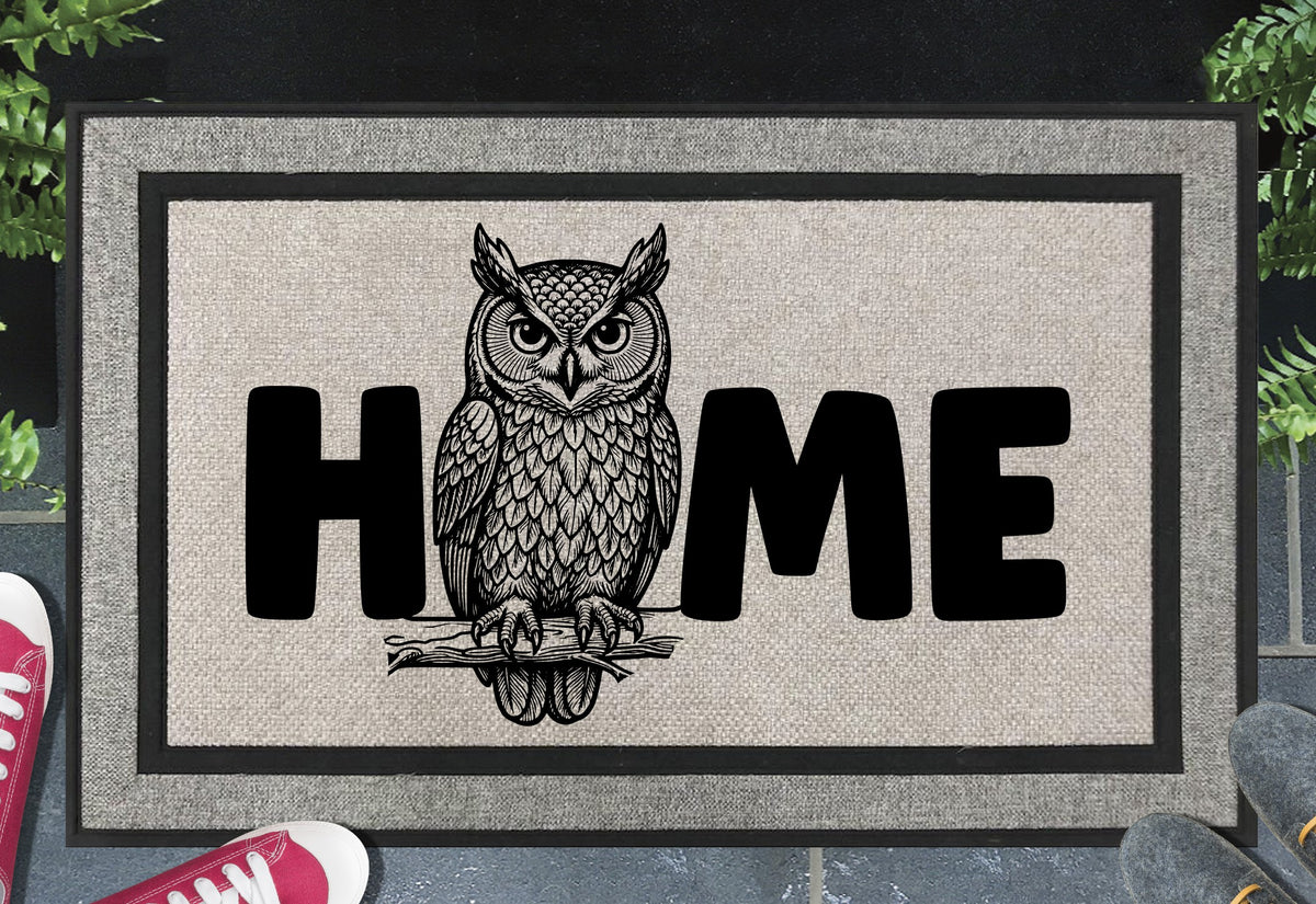 Eastern Screech Owl Doormat #1 All-Weather Shivering Owl Welcome Mat — Eastern Screech Owl illustration replacing the letter O in HOME, woven polyester linen-look finish, non-slip backing, flat lay on dark background