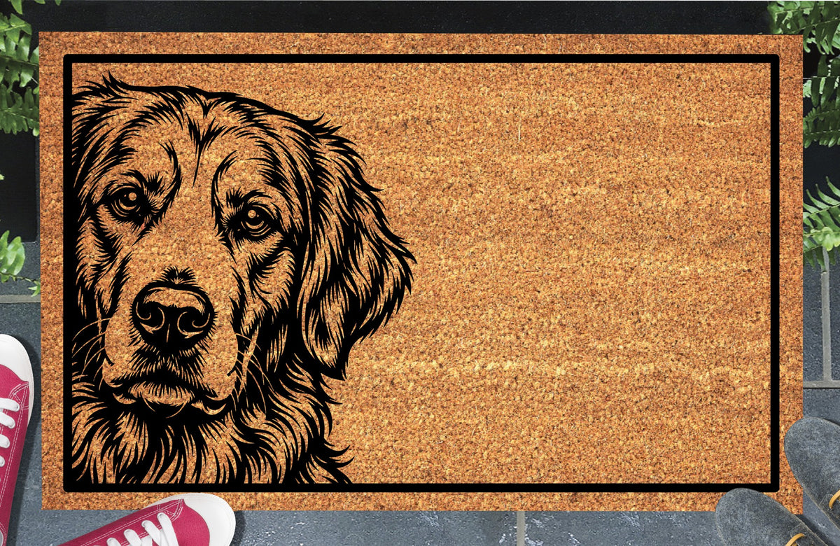 Golden Retriever Peeking Doormat #1, Goldie portrait peeking from the left edge inside a black border on natural coir, styled at an entryway.