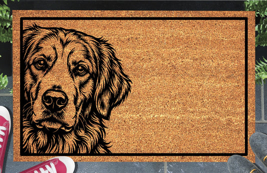 Golden Retriever Peeking Doormat #1, Goldie portrait peeking from the left edge inside a black border on natural coir, styled at an entryway.