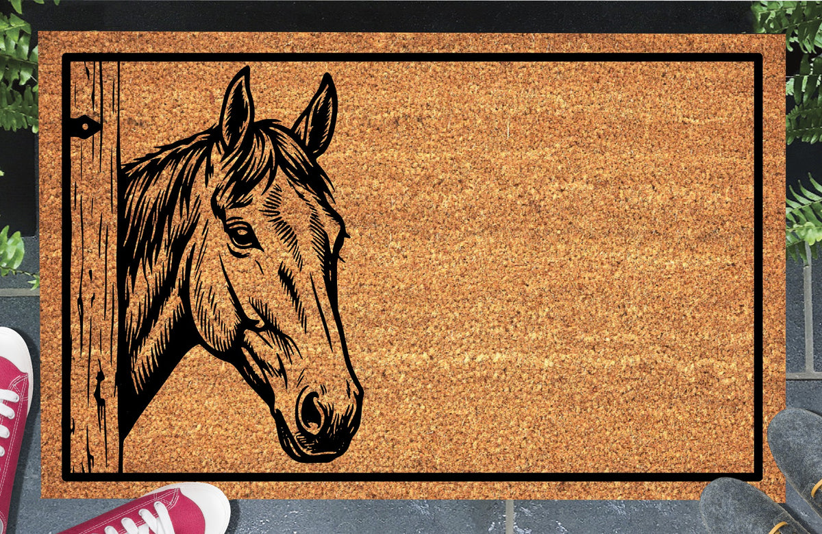 Irish Sport Horse peeking beside a wooden stable door on a natural coir doormat, with upright ears, a swept forelock and black border, shown at an entryway.