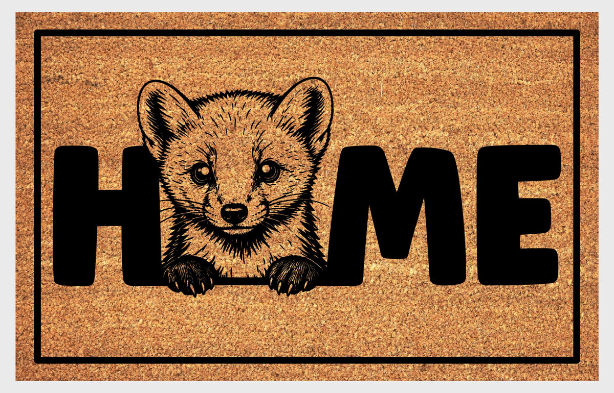 Pine Marten coir doormat flat lay — Pine Marten illustration replaces the letter O in HOME on natural coir